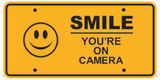 SMILE YOU'RE ON CAMERA ALUMINUM EMBOSSED LICENSE PLATE